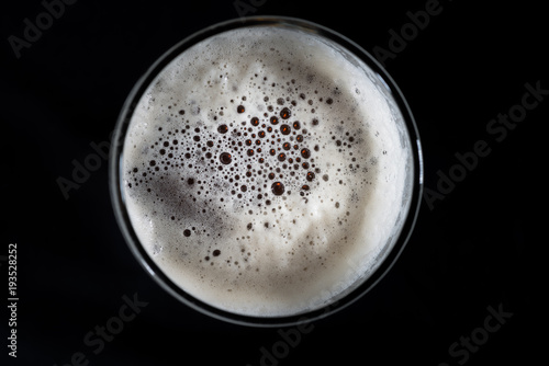 Top view glass of beer, beer foam and bubbles texture