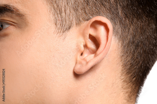 Young man, closeup. Hearing...