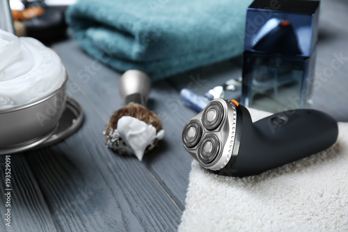 Electric shaver for man on wooden table