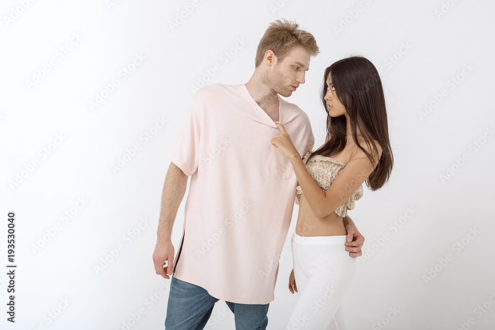 Sensual man hugging beautiful young woman Sensual man hugging beautiful young woman