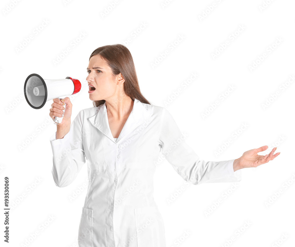 Female doctor with megaphone on white background