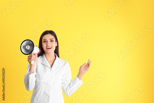 Female doctor with megaphon...