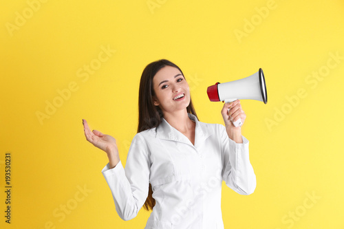 Female doctor with megaphon...