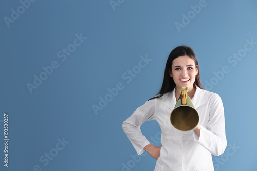 Female doctor with megaphon...