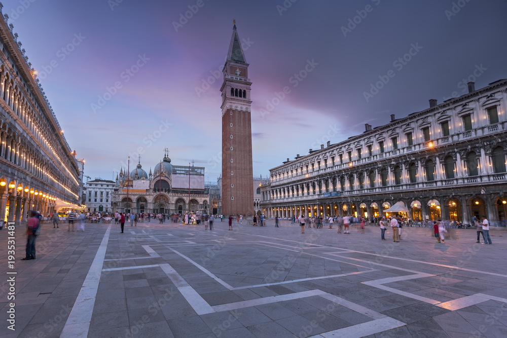 St. Mark Square Campanile and Doges Palace. Clock Tower of Venice against sunset sky, Italy.