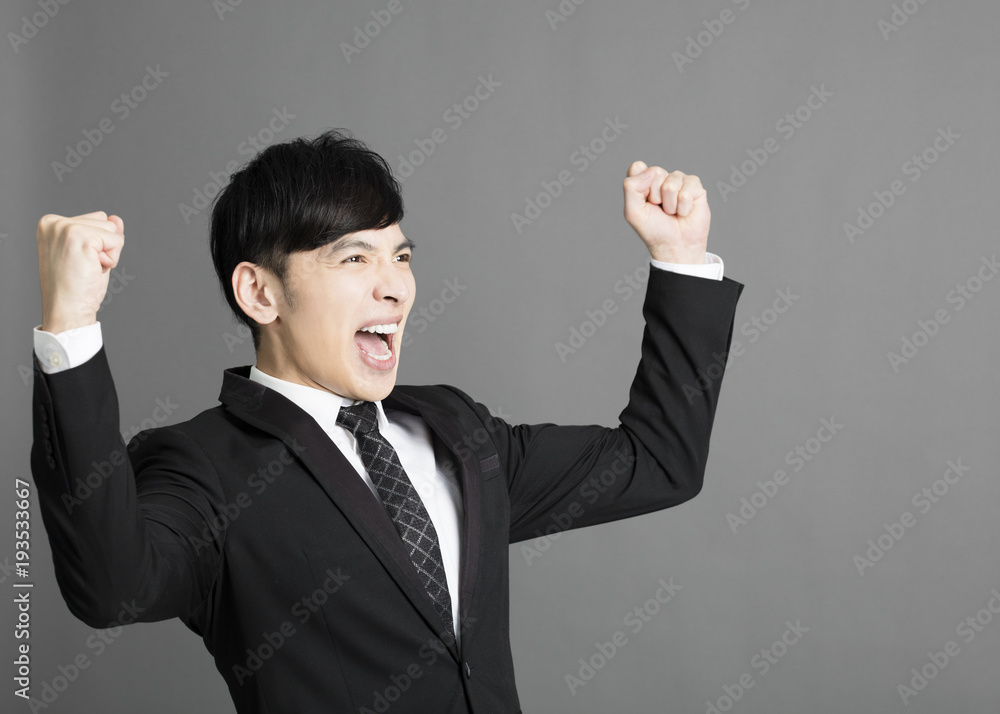 happy young business man with success gesture happy young business man with success gesture
