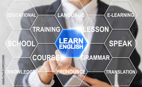 Businesswoman presses text button learn english on a virtual touchscreen. English Education Learning Foreign Language Online Training Web Courses. E-learning Webinar Course. photo