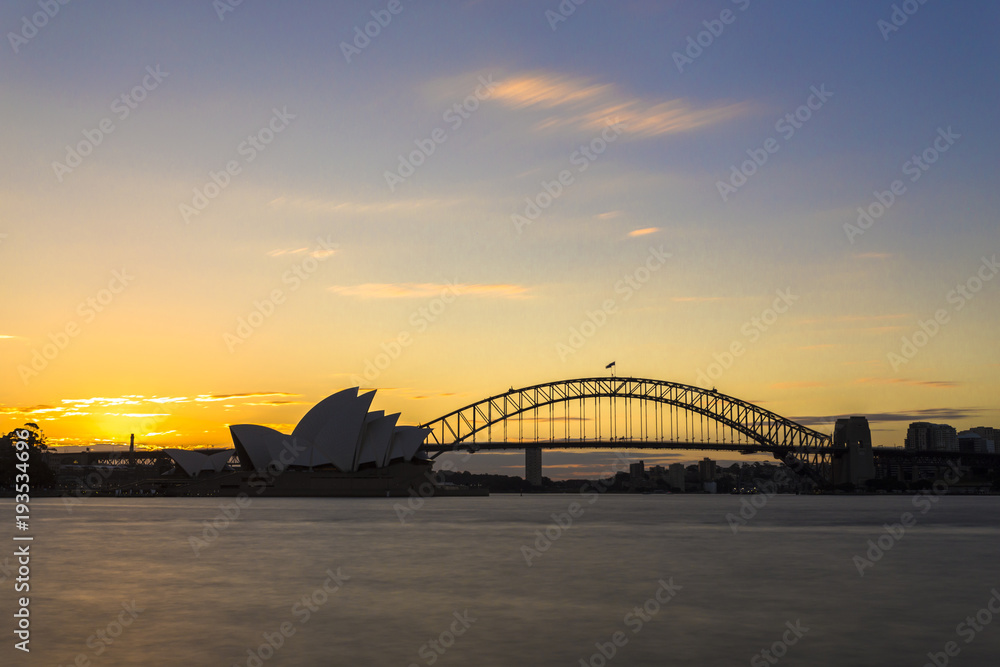 Naklejka premium Sydney skyline with harbour bridge linking south sydney city and north sydney city and opera house