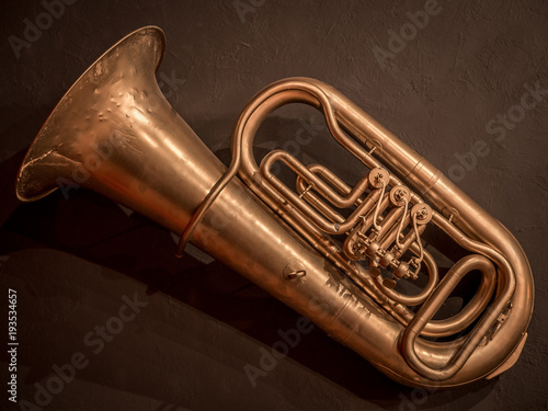 A musical musical tube hangs on the wall photo