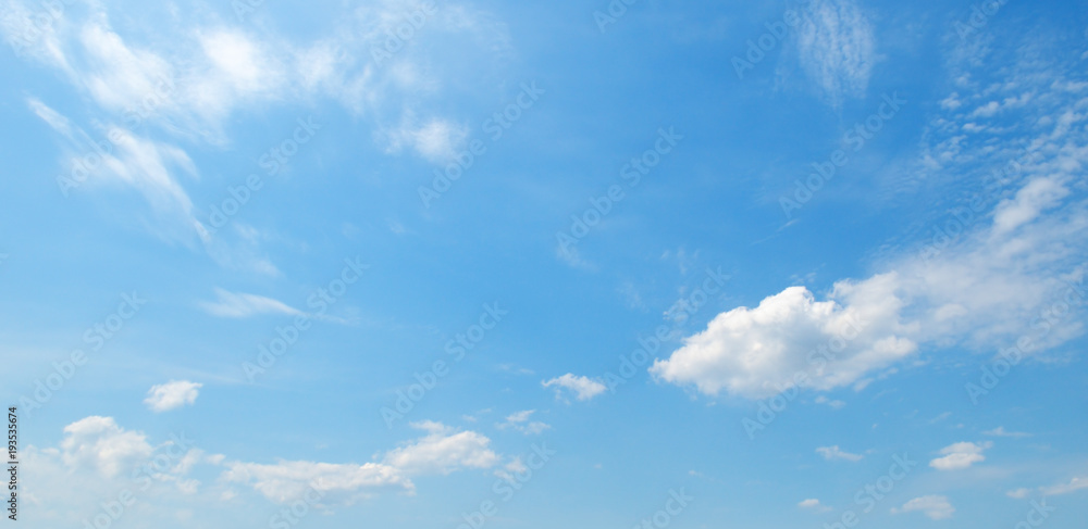 Light clouds in the blue sky. Wide photo