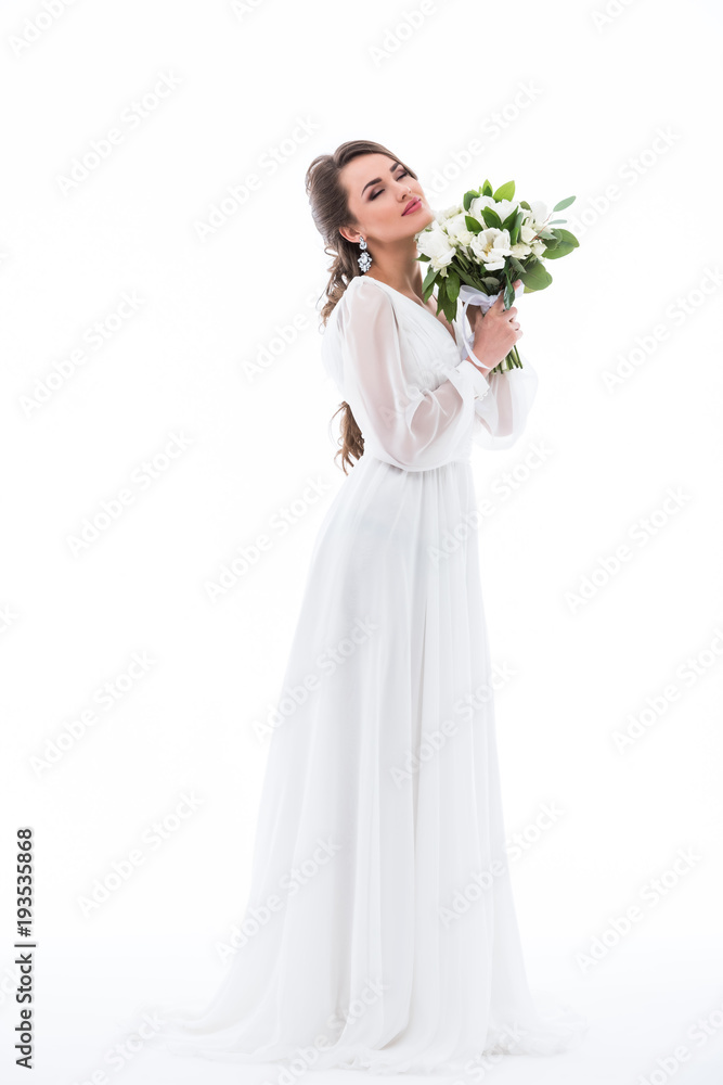 dreamy bride posing in dress with wedding bouquet, isolated on white dreamy bride posing in dress with wedding bouquet, isolated on white