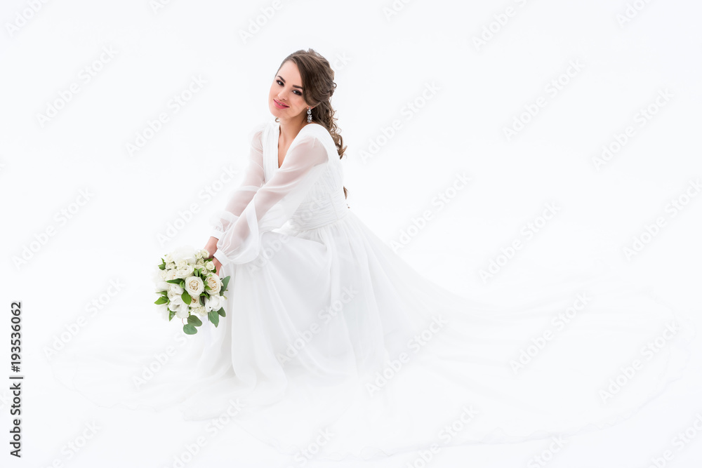 smiling bride in elegant dress holding wedding bouquet, isolated on white smiling bride in elegant dress holding wedding bouquet, isolated on white