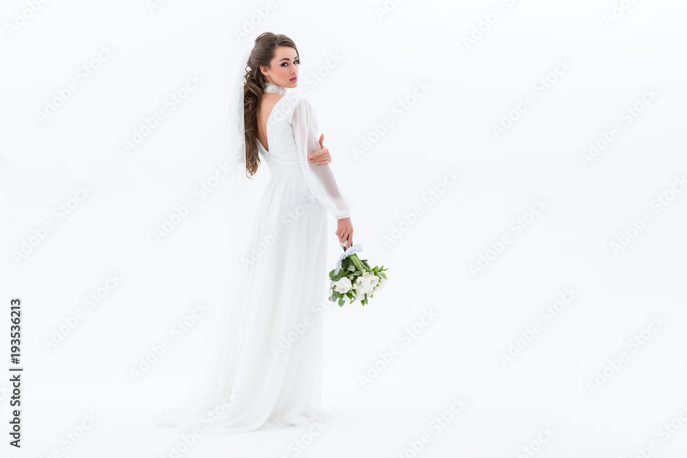 bride in traditional dress holding wedding bouquet, isolated on white bride in traditional dress holding wedding bouquet, isolated on white