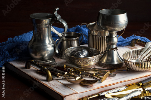 Old silver dishes with accessories for the kitchen