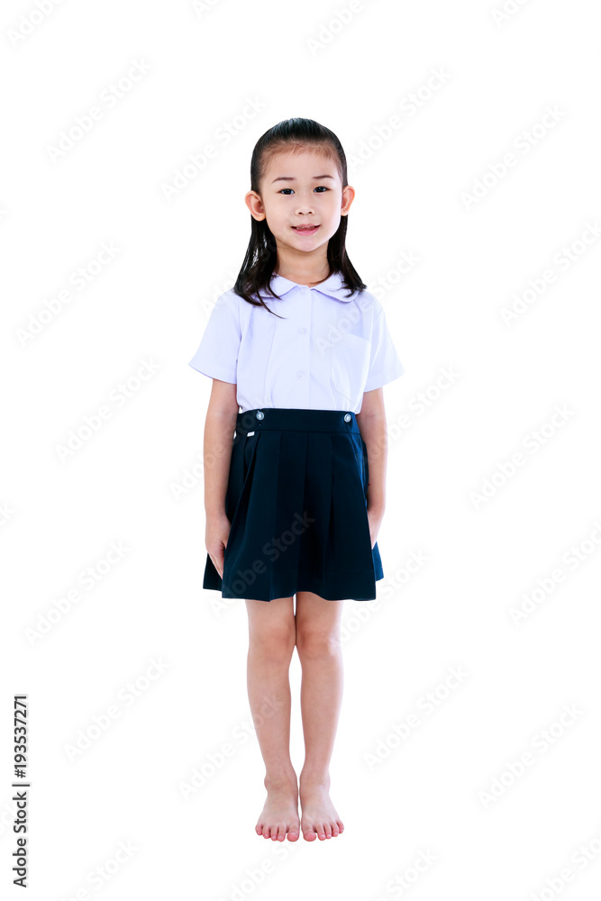 Young preschool child in uniform smiling at studio. Isolated on white background. Young preschool child in uniform smiling at studio. Isolated on white background.