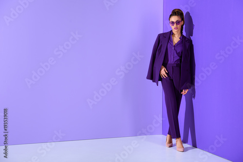 fashionable african american girl posing in trendy purple suit, ultra violet trend photo