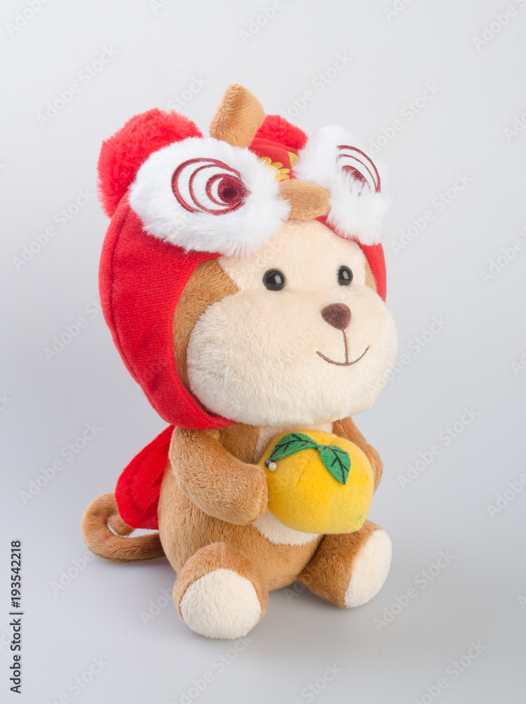Fototapeta premium Toy or Chinese Year of the Monkey Stuffed Animals Children Toys on background.