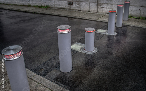 Retractable (lifting) bollards with warning light to enable or block traffic photo