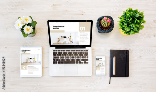 top view devices with scandinavian design web site on screen