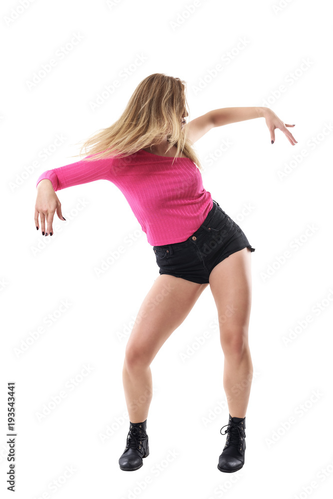 Action movement of female jazz dancer with flowing blonde hair toss. Full body length portrait isolated on white studio background. Action movement of female jazz dancer with flowing blonde hair toss. Full body length portrait isolated on white studio background.