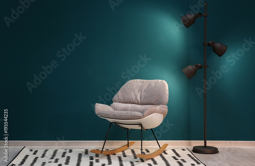Trendy armchair with lamp n...
