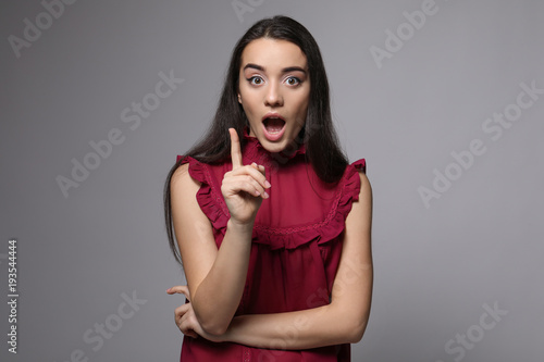 Attractive young woman in c...