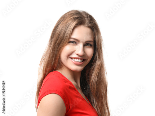 Smiling young woman in casual clothes on white background © Africa Studio