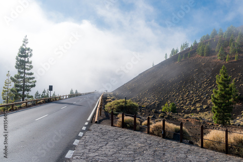 Vernebelte Bergstraße im Nationalpark Teide auf über 3.000 Meter Höhe führt direkt in die Wolken photo