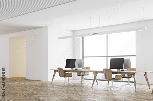 Computers in an open space office corner  wood