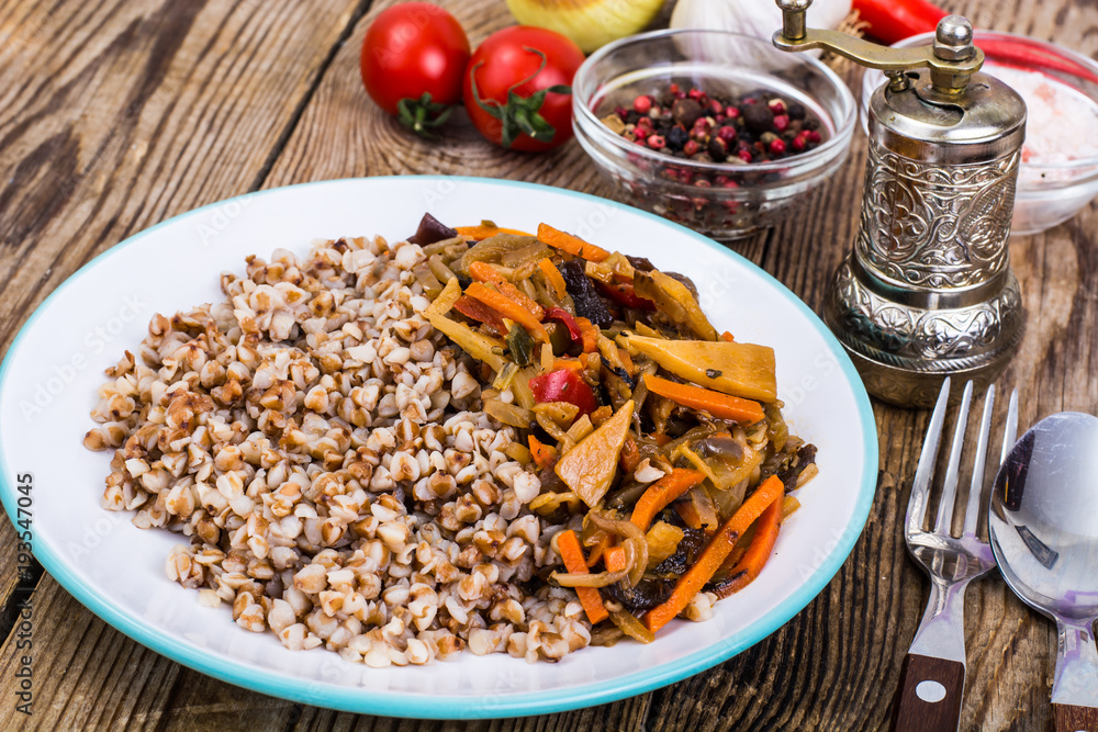 Vegetarian dish. Grain porridge with stewed vegetables Vegetarian dish. Grain porridge with stewed vegetables