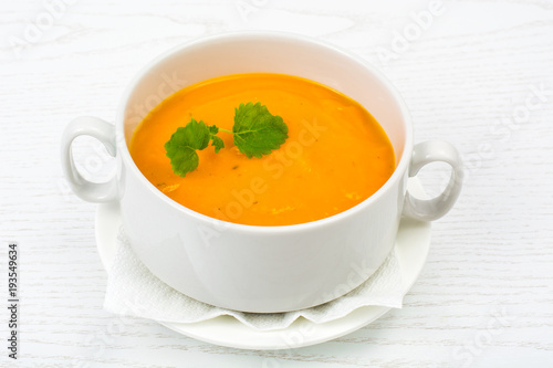 Cream soup of carrots, pumpkins, vegetables in white soup