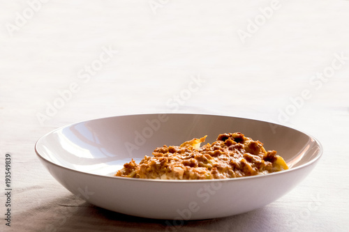 close up of isolated dish of italian lasagna on white background