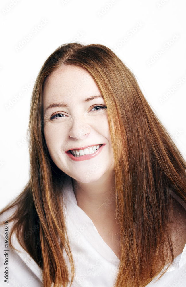 Beautiful young redhead woman with freckles portrait isolated on white Beautiful young redhead woman with freckles portrait isolated on white
