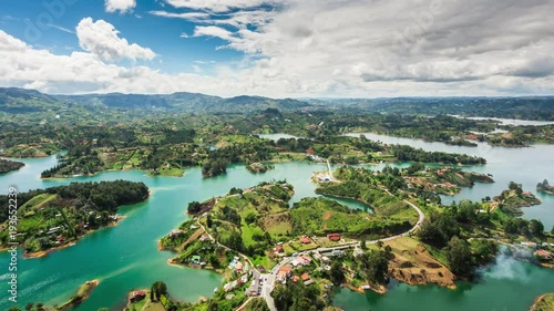 Medellin, Colombia, time lapse view of Guatape from the Rock (La Piedra del Penol) during daytime. Zoom out. photo