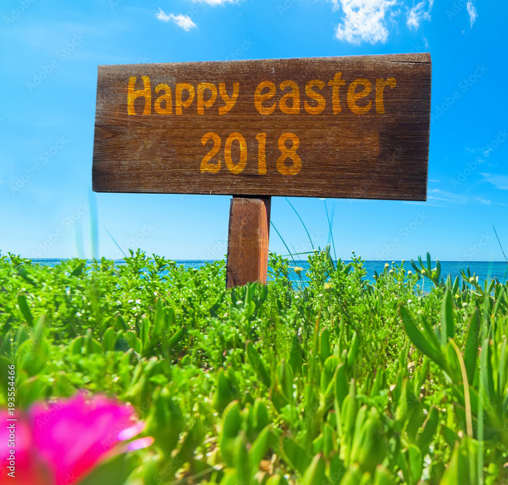 Happy easter 2018 written on a wooden sign