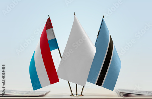 Flags of Netherlands and Botswana with a white flag in the middle