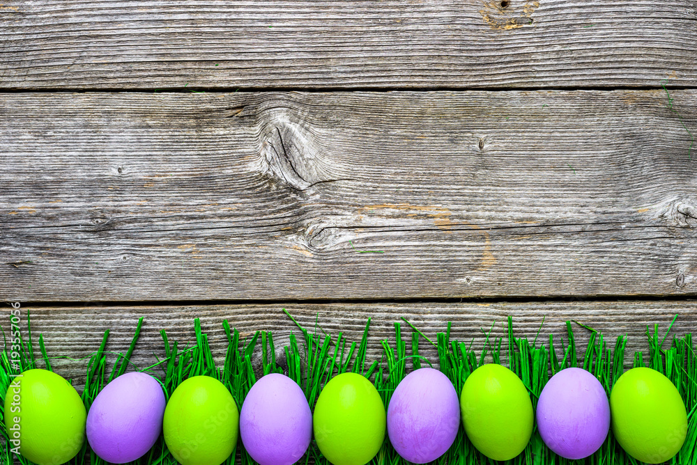 Painted eggs on grass, happy easter eggs background Painted eggs on grass, happy easter eggs background
