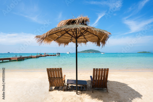 Fototapeta Naklejka Na Ścianę i Meble -  Beach Chairs and Umbrella on summer island in Phuket, Thailand. Summer, Travel, Vacation and Holiday concept.