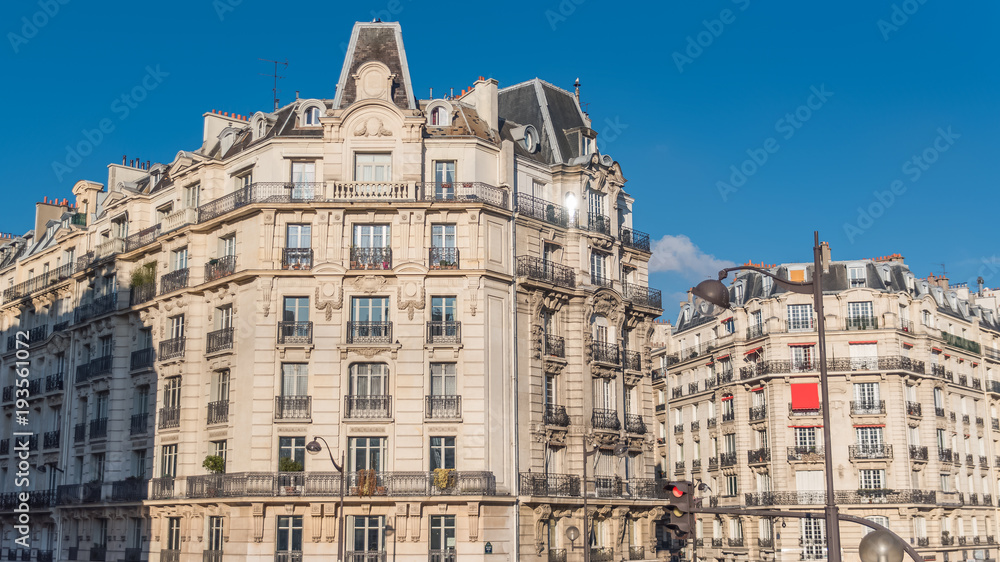 Paris, typical facade in a charming district, beautiful building 
