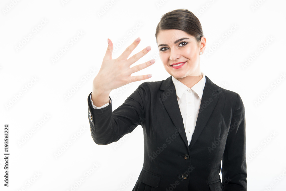 Portrait of beautiful female flight attendant showing number five Portrait of beautiful female flight attendant showing number five
