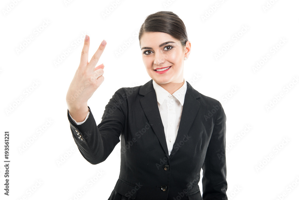 Portrait of beautiful female flight attendant showing number two Portrait of beautiful female flight attendant showing number two