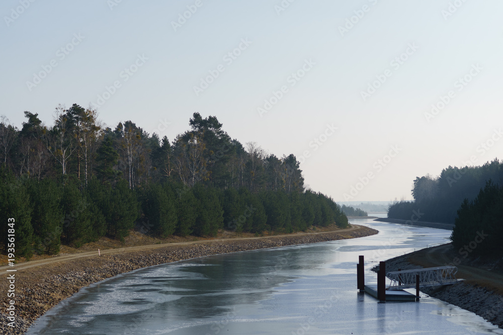 Winter view of Sornoer Canal. Canal connect lakes Geierswalder See and Sedlitzer See. The surroundings of Senftenberg. Germany. Federal state of Brandenburg. Winter view of Sornoer Canal. Canal connect lakes Geierswalder See and Sedlitzer See. The surroundings of Senftenberg. Germany. Federal state of Brandenburg.