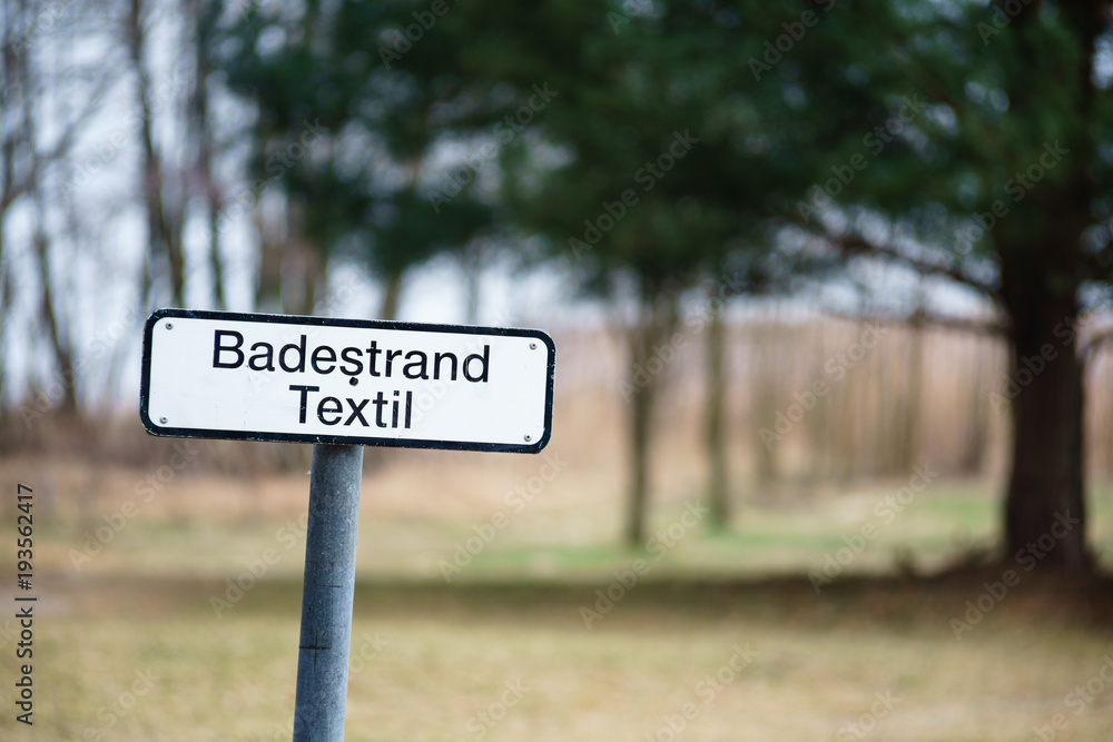 Pointer on a public beach. Bathing is allowed only in swimsuits and/or swim briefs (in German: Badestrand Textil). Pointer on a public beach. Bathing is allowed only in swimsuits and/or swim briefs (in German: Badestrand Textil).