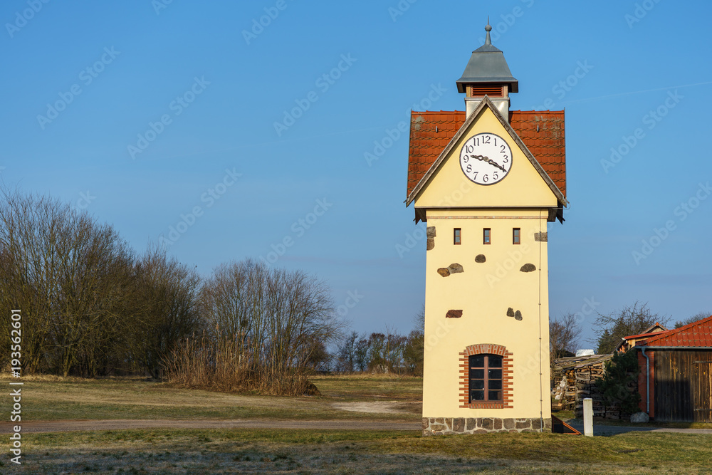 Clock Tower in one of the oldest villages in Germany - Gielsdorf (Altlandsberg). The first mention in the chronicles of 1375. Federal state of Brandundburg.