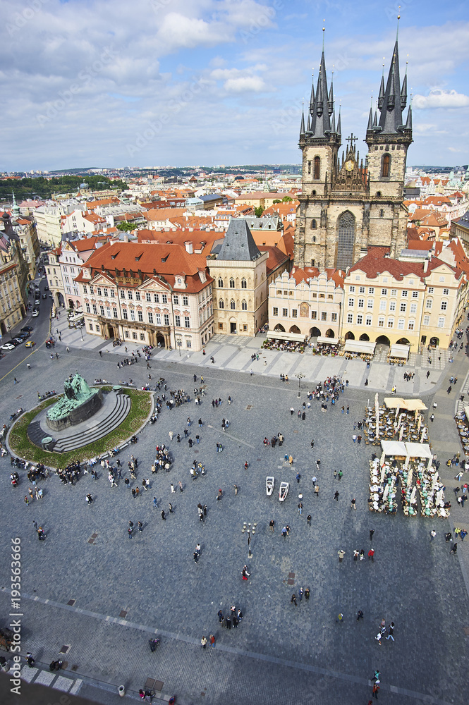 Old Town of Prague, Czech Republic. View on Tyn Church and Jan Hus Memorial on the square as seen from Old Town City Hall.