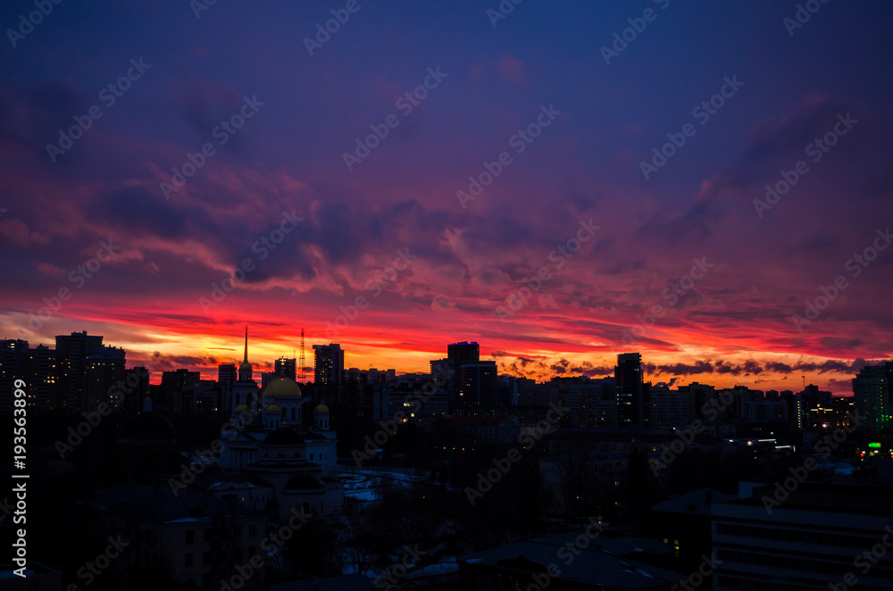 A magnificent sunset in the city of Ekaterinburg struck the inhabitants with its beauty. The day is not over yet, because it's getting dark early in the winter.