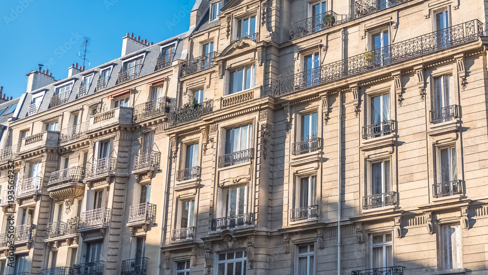 Paris, typical facade in a charming district, beautiful building 
