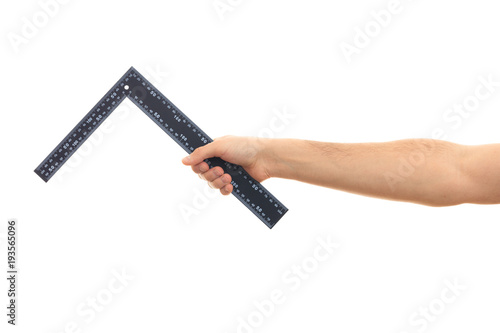 Man holding a carpenter ruler L shape on white background