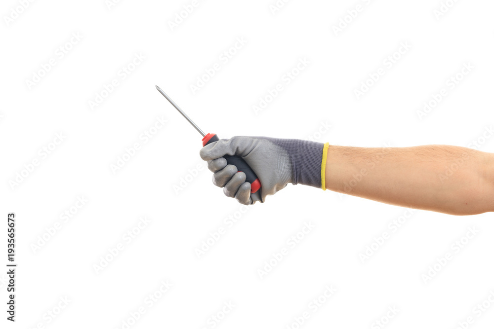 Hand holding a manual screwdriver on white background Hand holding a manual screwdriver on white background
