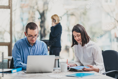 Colleagues working in office